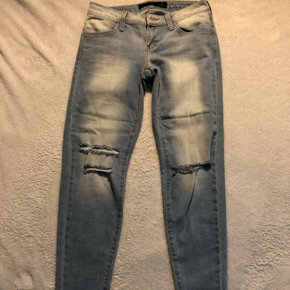 Blue jeans knee ripped